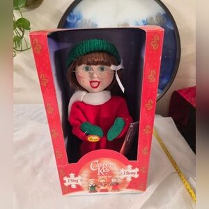 Carolyn's Kids Singing Doll with Green Hat and Red Outfit